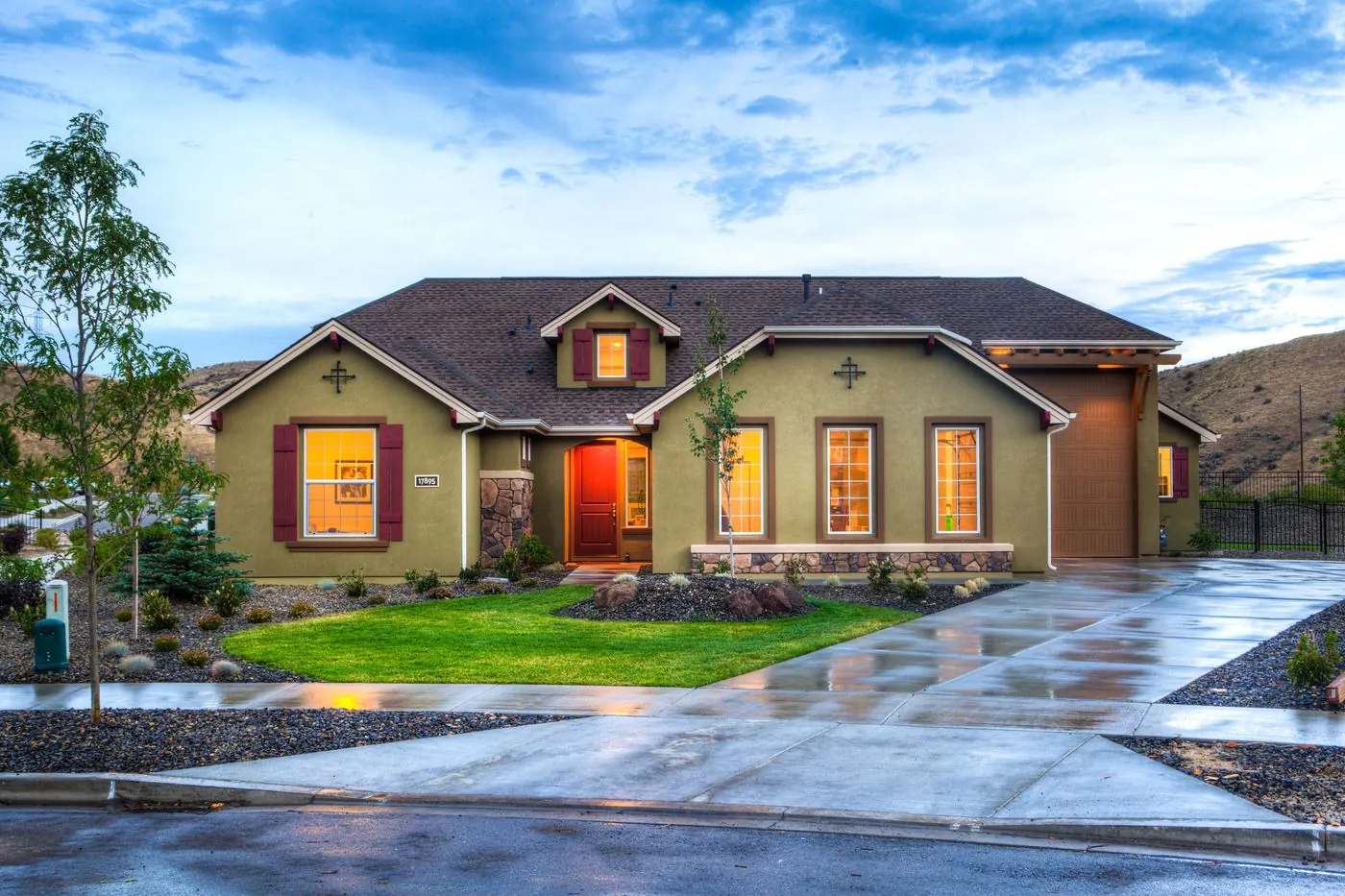 Clean residential property exterior with lawn and driveway
